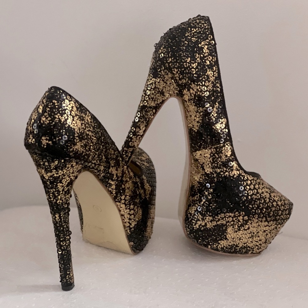 Black and gold privileged stilettos